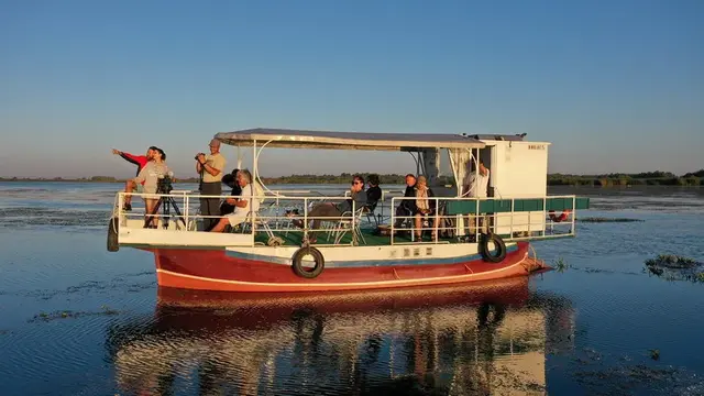 Birdwatching from motorboat in Danube Delta channels