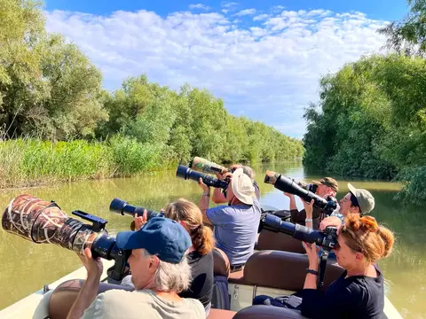 Wildlife photographers on a boat in the Danube Delta